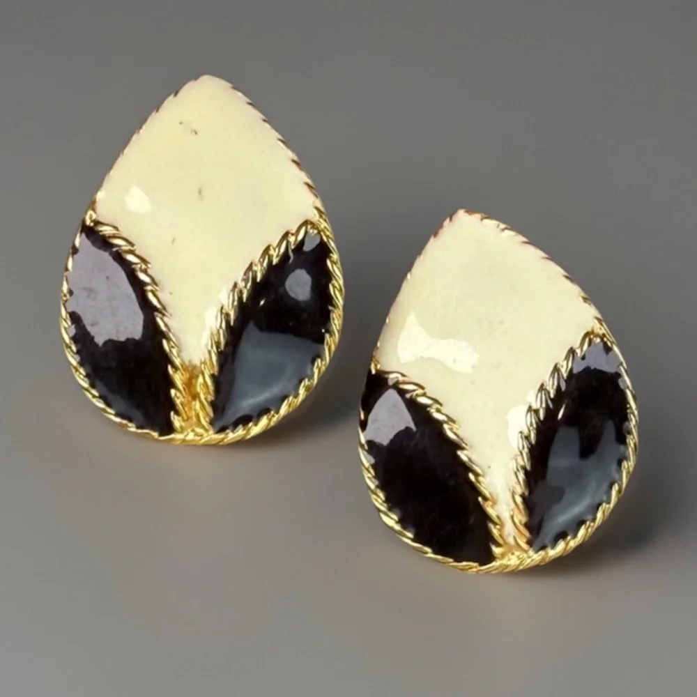 Vintage goldtone, black and cream enamel clip on earrings